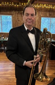 Musician Robert Haus holding a trumpet